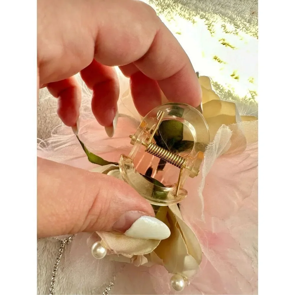 Light pink rose with feather hair claw